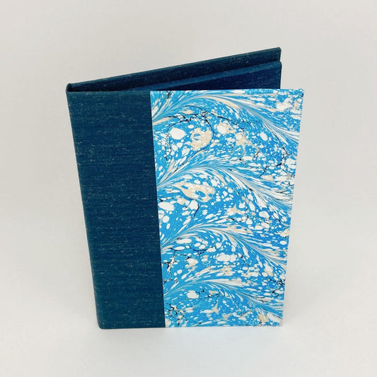 Notepad cover with blue linen and blue and white marbled cover